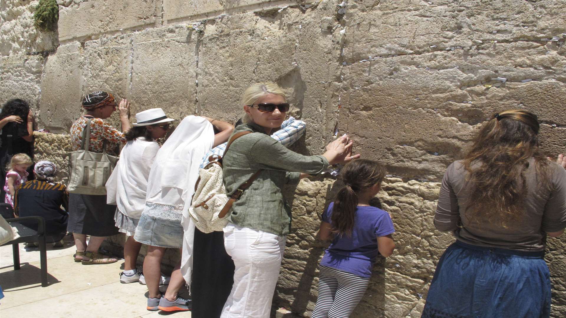 Leaving a handwritten note at the Western Wall