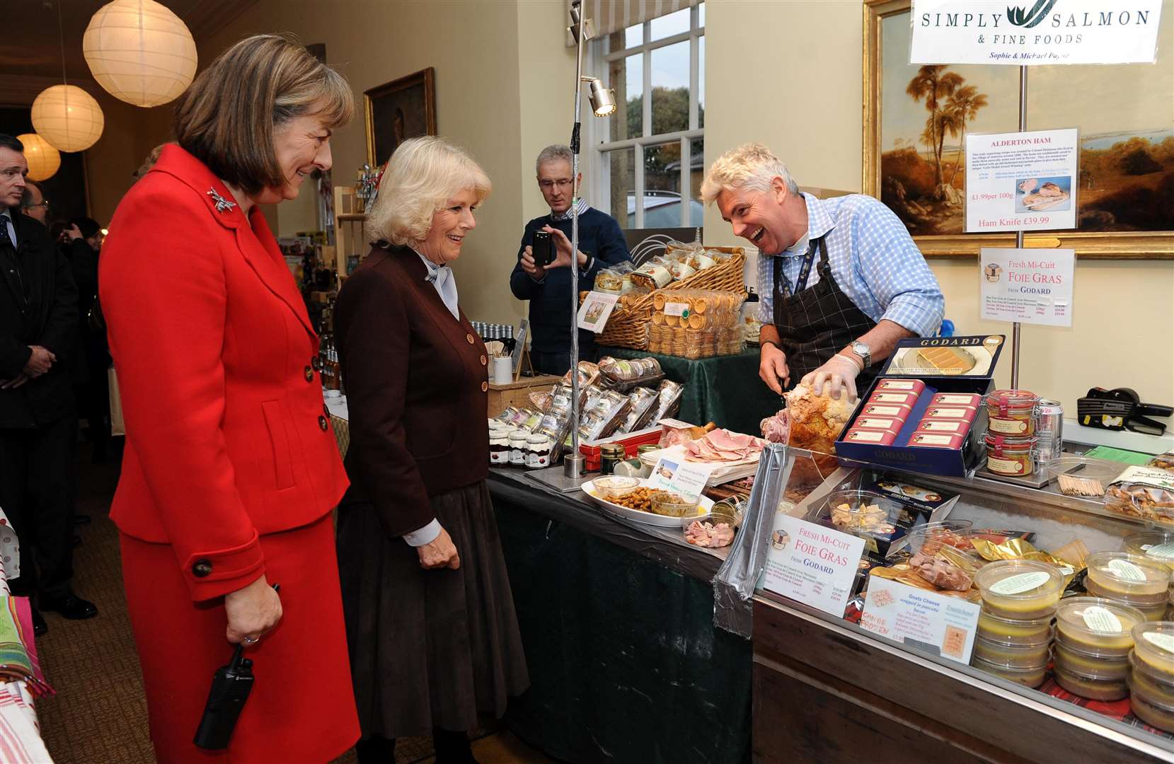 The then-Duchess of Cornwall with Lady Lansdowne during a visit to the Bowood House Christmas Extravaganza in 2012 (Andrew Matthews/PA)