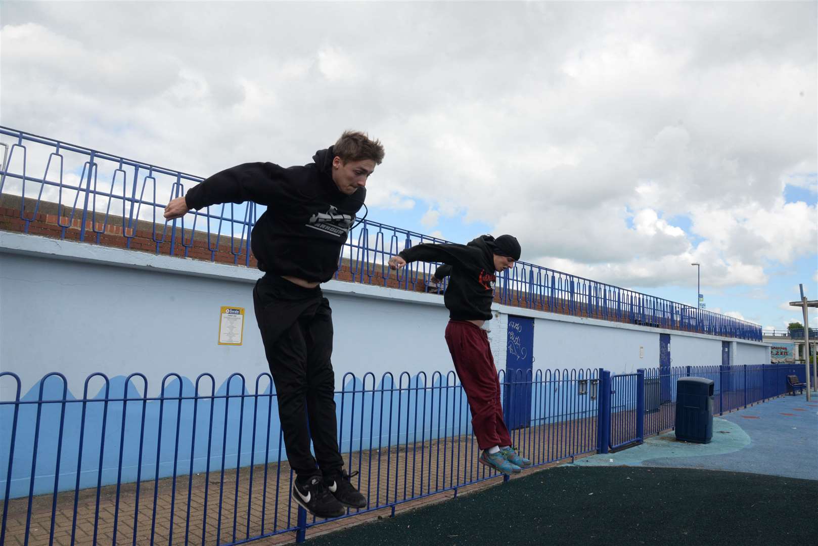 Parkour coach Adam McKenna and John-Daniel Scullion jump from the promenade into the skate park. Picture: Chris Davey