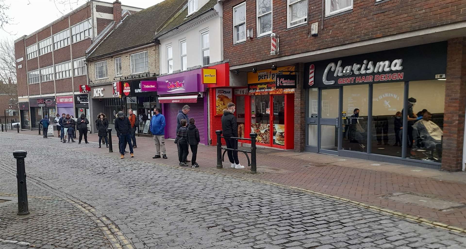 Queues have formed outside Ashford's barbers throughout the day