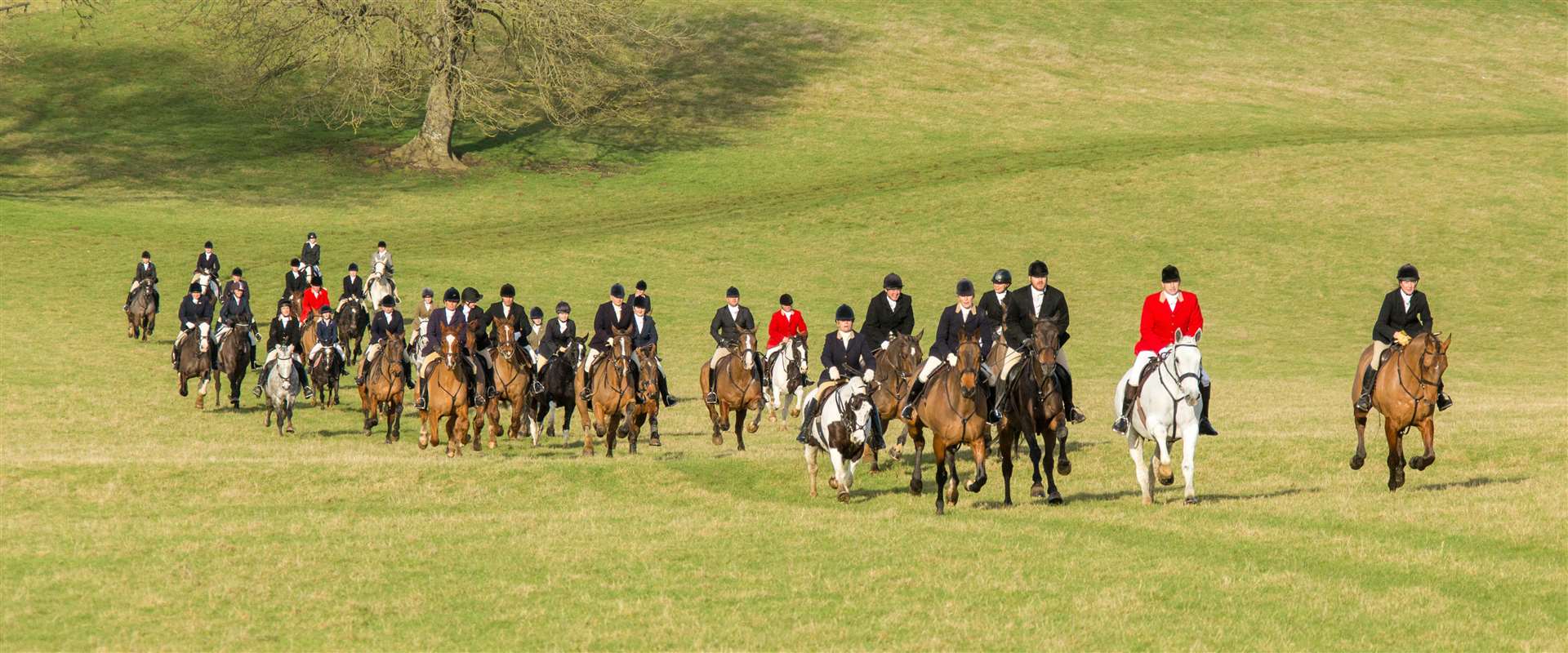 The hunt sets off into the countryside following a scented trail. Photo: The Gather Photography.