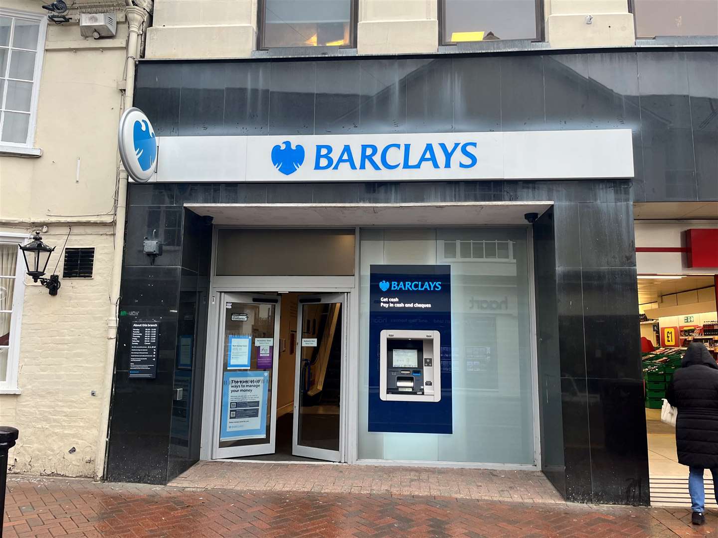 An elderly woman was scammed out of £800 after she was targeted by fraudsters at a cash machine outside Barclays in Ashford