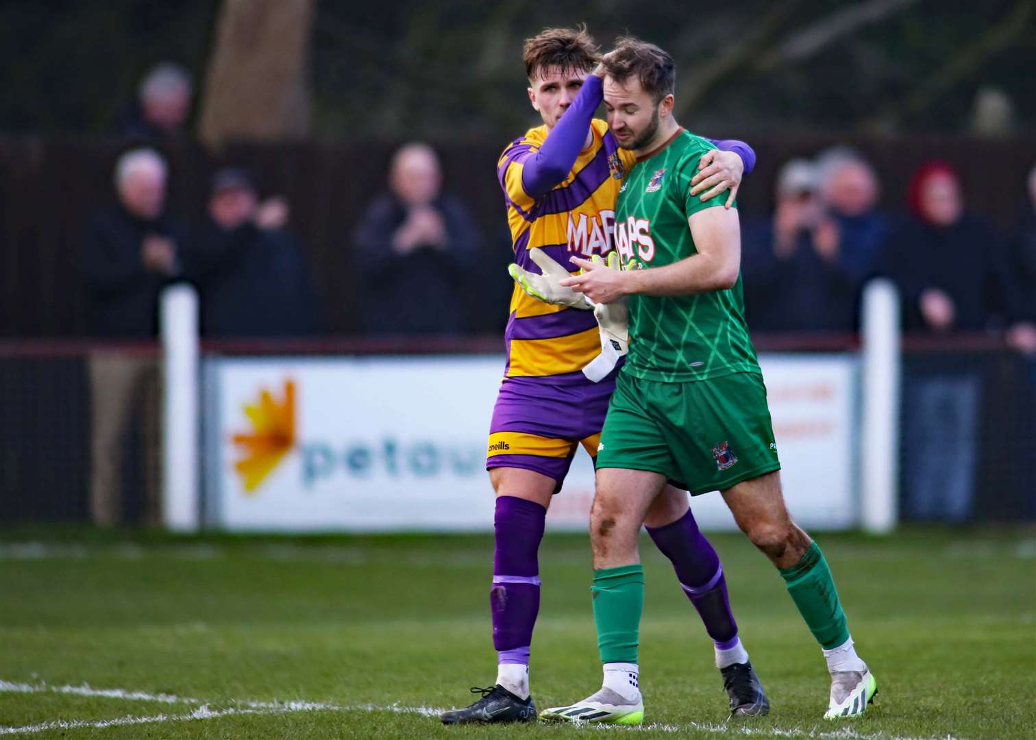 Defender Alfie Foster consoles Deal keeper James Tonkin after their FA Vase penalty shoot-out exit Picture: Paul Willmott