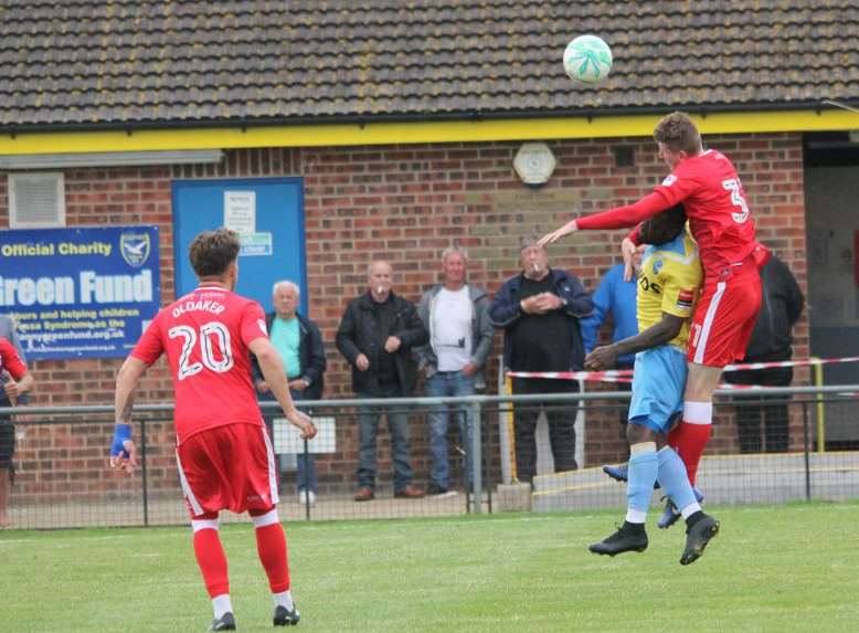 Ryan Huckle wins a header for Gillingham at Canvey Picture: Kieran Argent / KJA Sports Images