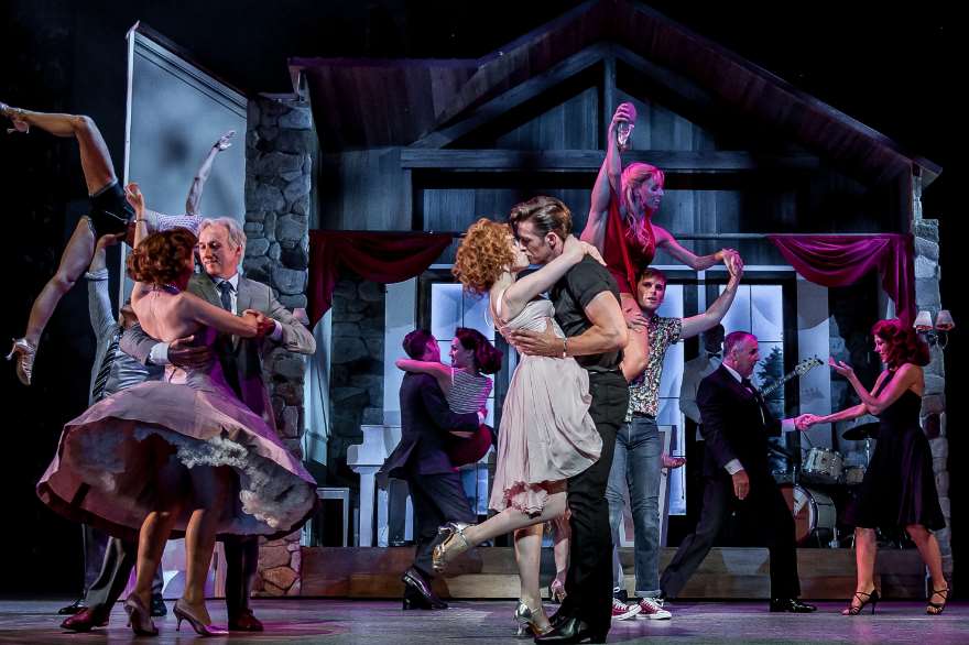 Katie Hartland as Baby and Lewis Griffiths as Johnny with the cast of dancers in Dirty Dancing at the Orchard Theatre