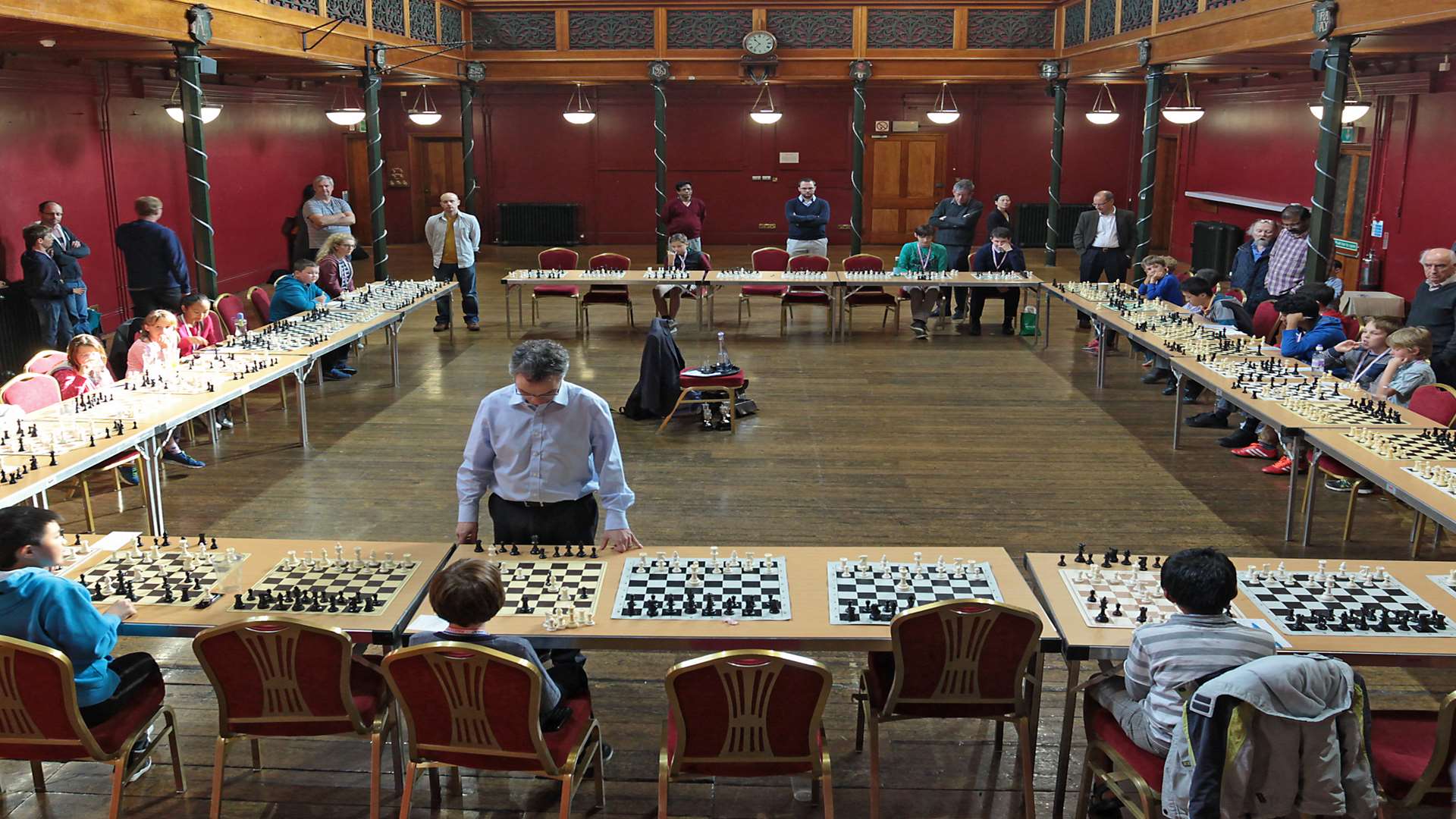 John Emms in action against some of the 34 young chess players who took part in the tournament at the Salomons Estate