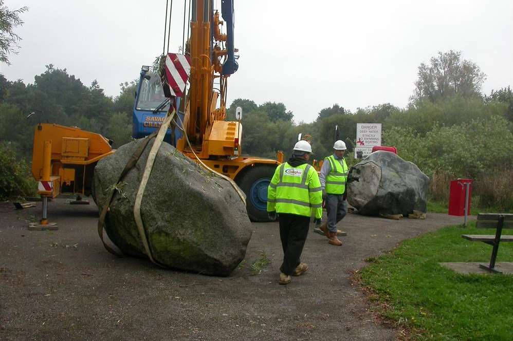 Workmen removing the boulders from their old home at Singleton Lake