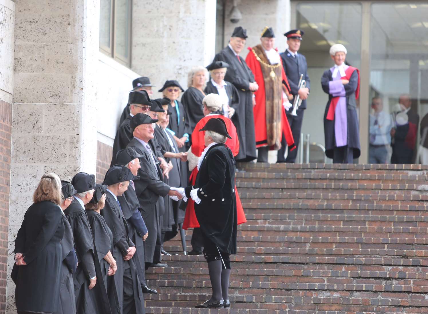 Officials, including Maidstone's mayor cllr Malcolm Greer greet the new judge on the steps to Maidstone's Crown Court