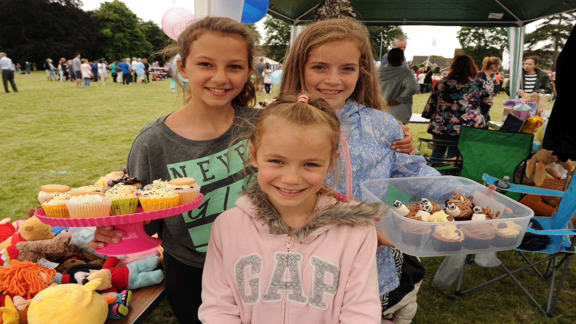 Darent Valley Hospital, Dartford. Stride4Life fun day. Neve and Layla-Rose (11,10) with Amy (8) at the cake stall.