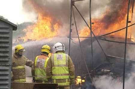 Firefighters tackle the flames. Picture: PAUL DENNIS