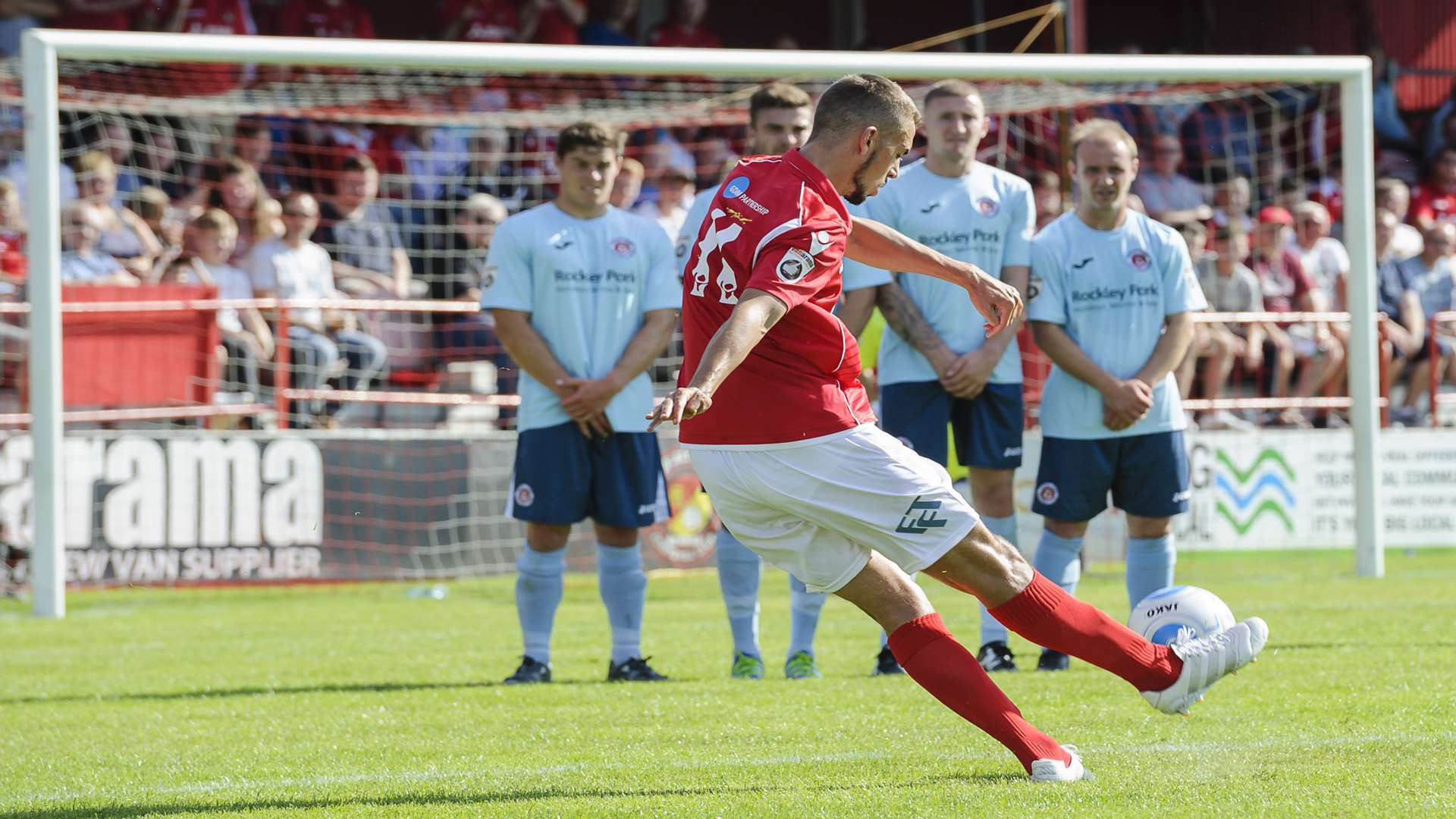 Jack Powell curls home the free kick for Ebbsfleet's fourth against Poole Pic: Andy Payton