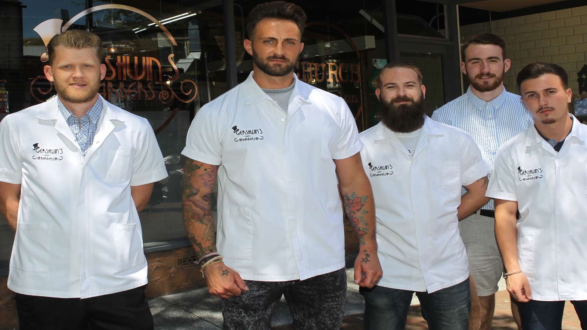 James Payne, owner of Gerswin's Barbers, second from left with his team.