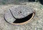 The broken manhole cover in the car park