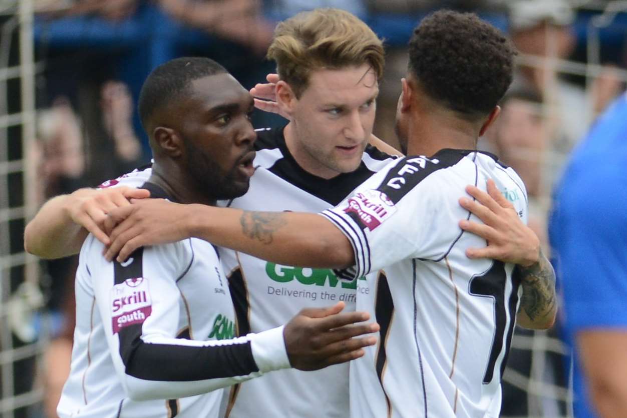 Ryan Bird, centre, celebrates a goal Picture: Gary Browne