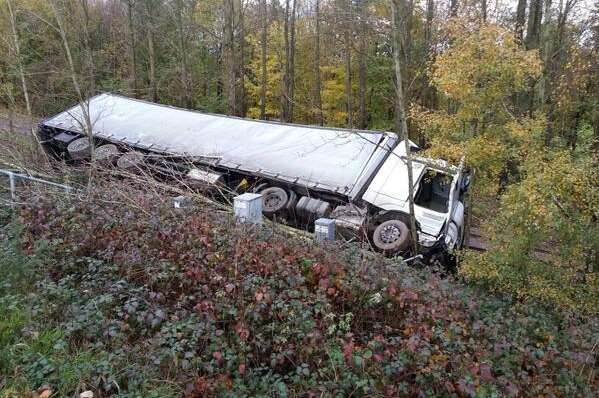 The lorry on its side down an embankment. Picture: Kent Police roads