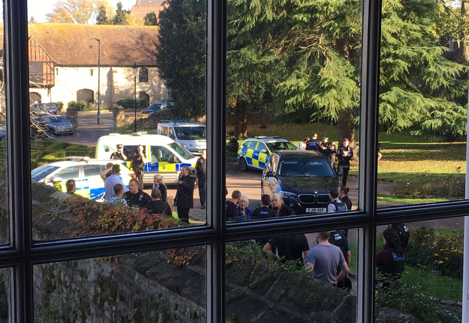 Police swarm the Archbishops Palace in Maidstone