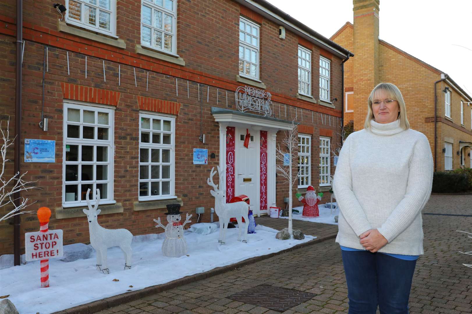 Kim Ellis next to her Christmas lights outside her home in Kings Hill. Picture: Andy Jones