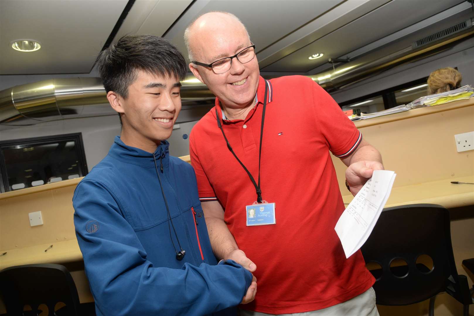 Eason Lam is congratulated by Head Paul Jackson on his A Level results at the Thomas Aveling School, Rochester. Piccture: Chris Davey.