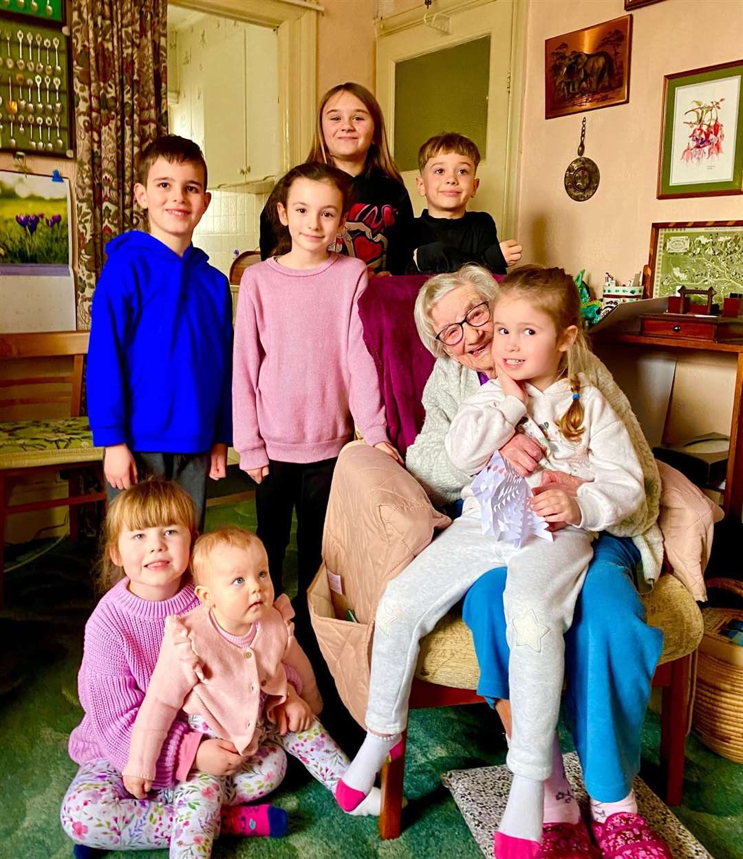 Hilda Luck surrounded by all her great-grandchildren. Back row: Olivier & Cooper, middle row: Cody, Sophia Hilda and Evelynfront row: Eliza and Rosie. Photo credit: Ronnie Luck