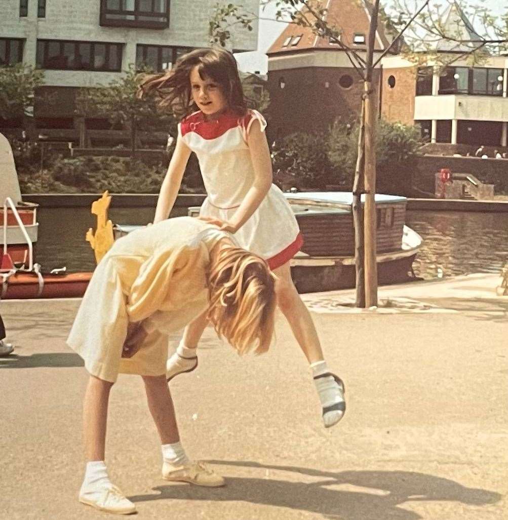 Angela playing leapfrog with her friend Kelly by the River Medway, opposite the Maidstone law courts. Picture: Angela Barnes