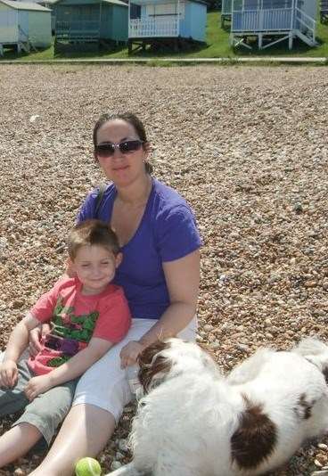 Kathryn Derby, with her son and dog Holly, is against the ban