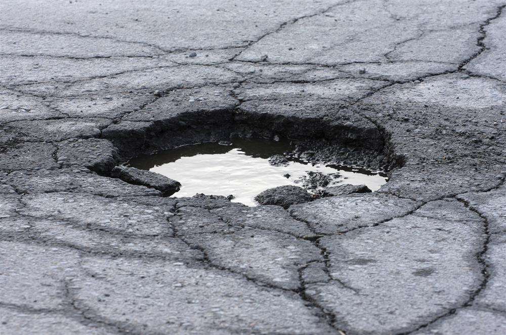 A hole in the road. Stock image