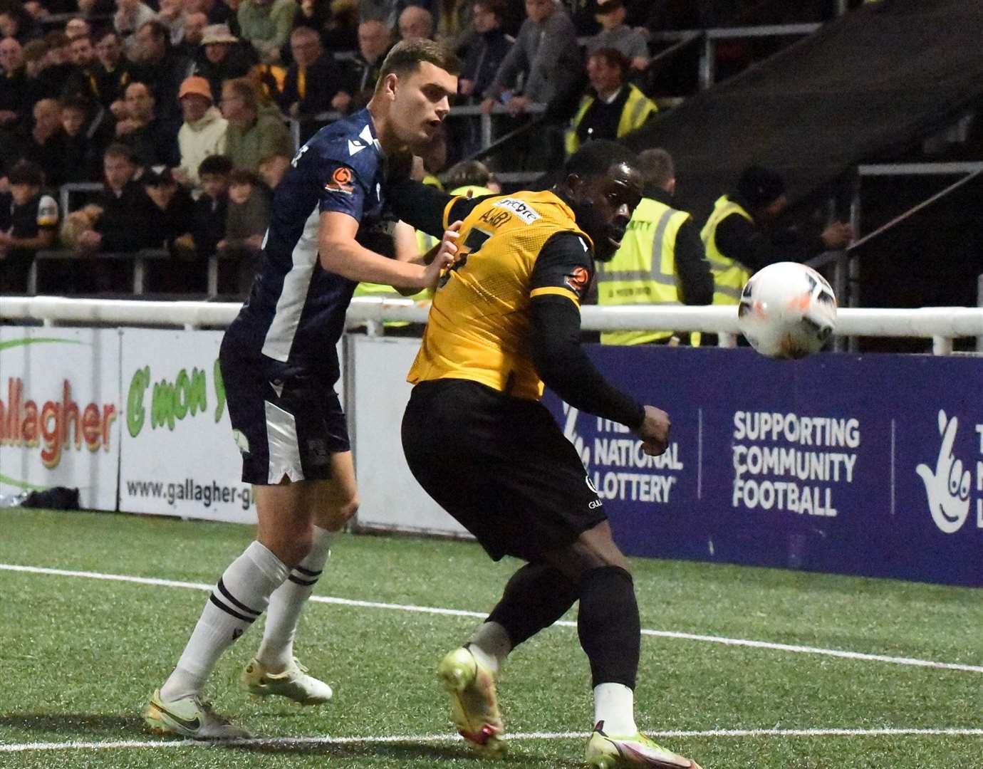 James Alabi holds off his man during Maidstone's 3-0 defeat by Southend on Tuesday night. Picture: Steve Terrell