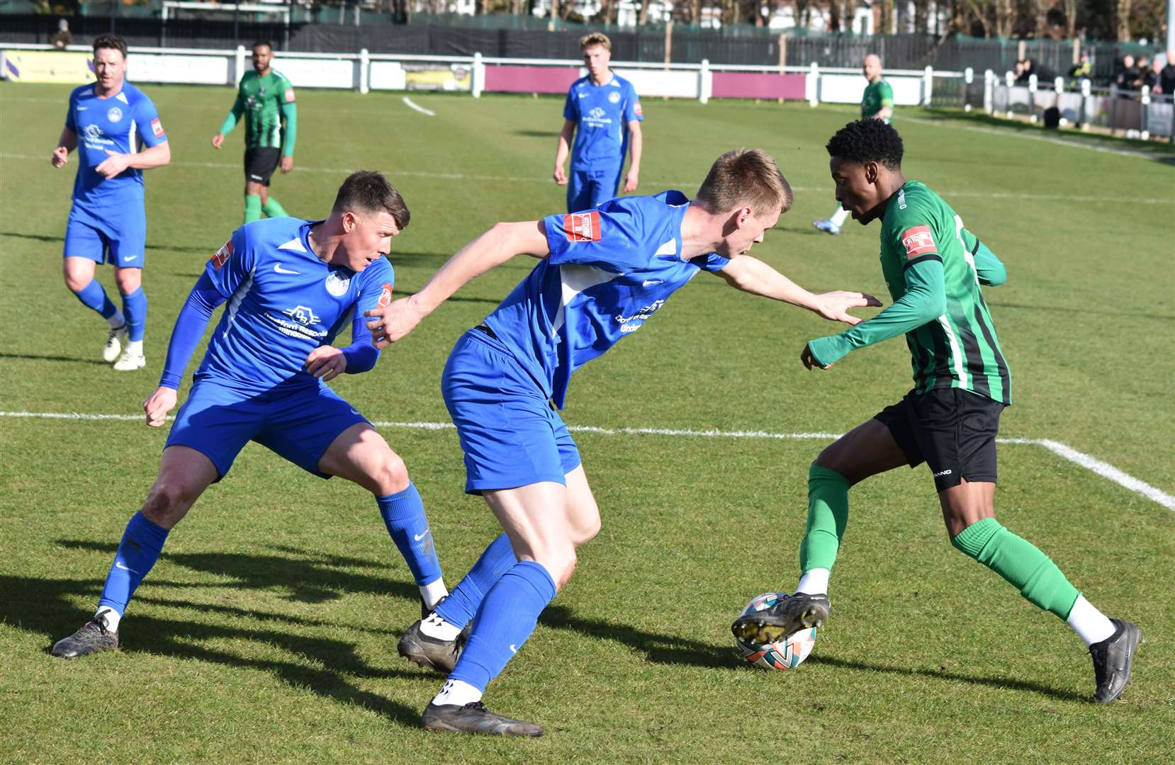 Kyrell Lisbie looks to get the better of Sam Flisher and Lex Allan during Cray Valley's 2-0 win over Hythe. Picture: Alan Coomes