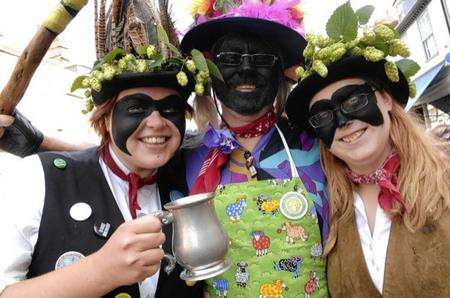 Emma Standen, Steve Hoad and Ruth Taylor of Dead Horse Morris take a break from dancing at the Faversham Hop Festival in 2011