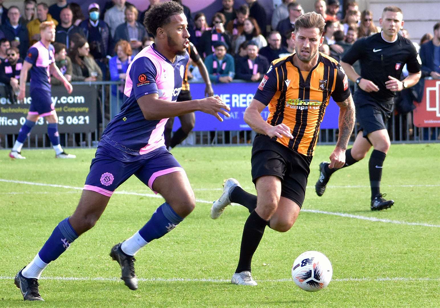 Folkestone's James Rogers, right, during their 1-0 FA Cup win at Dulwich. Picture: Randolph File