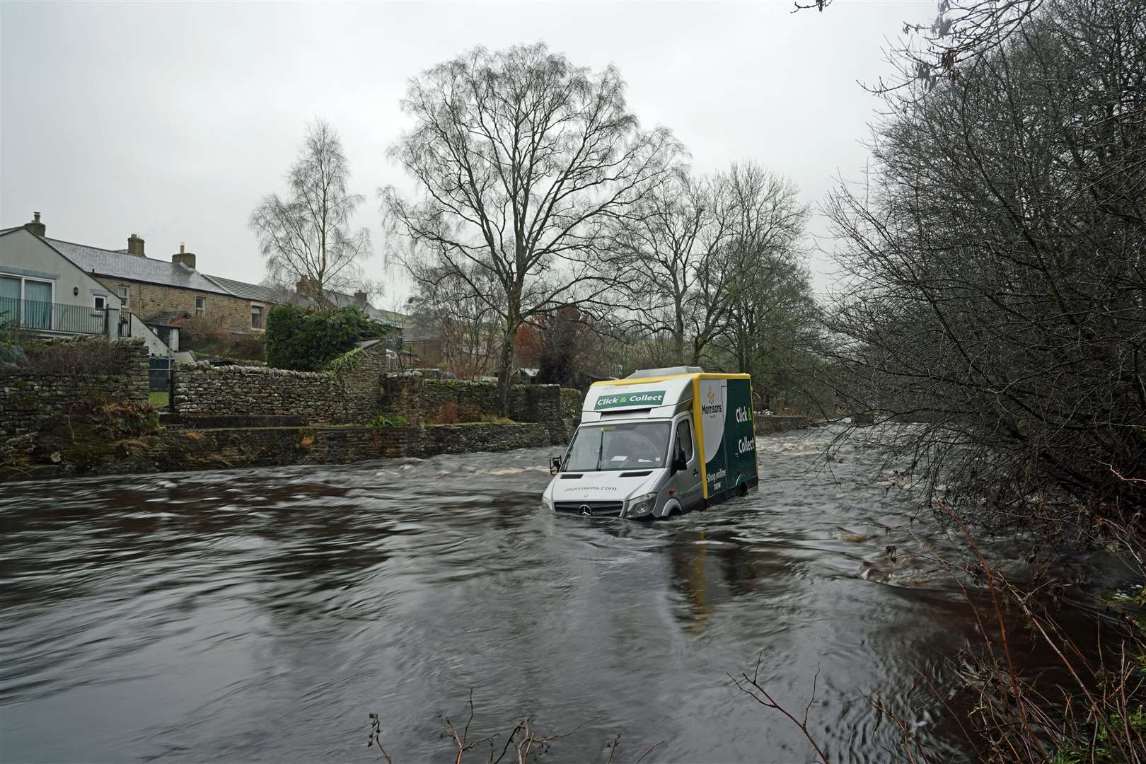 A supermarket delivery van in the River Wear at Westgate, County Durham (Owen Humphreys/PA)
