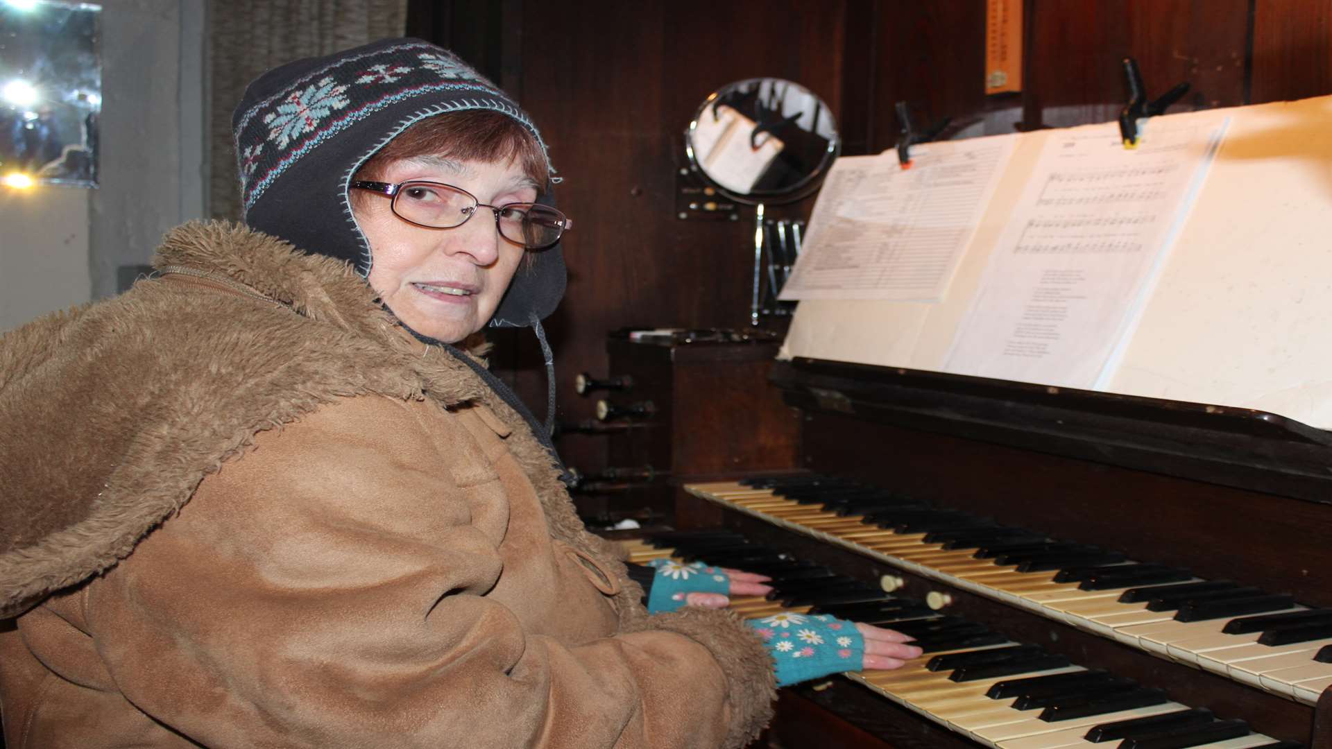 Chilling out: church organist Sylvia Baker with mittens
