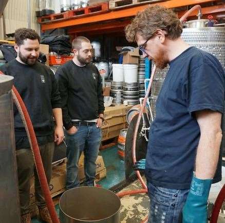 Head brewer Calvin Gear inspects his ale
