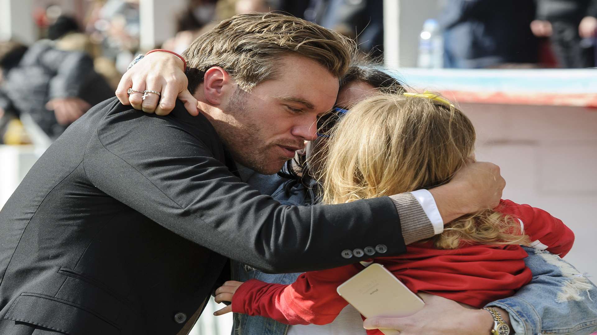 Daryl McMahon celebrates Ebbsfleet's promotion with his wife Alex and daughter Marnie Picture: Andy Payton