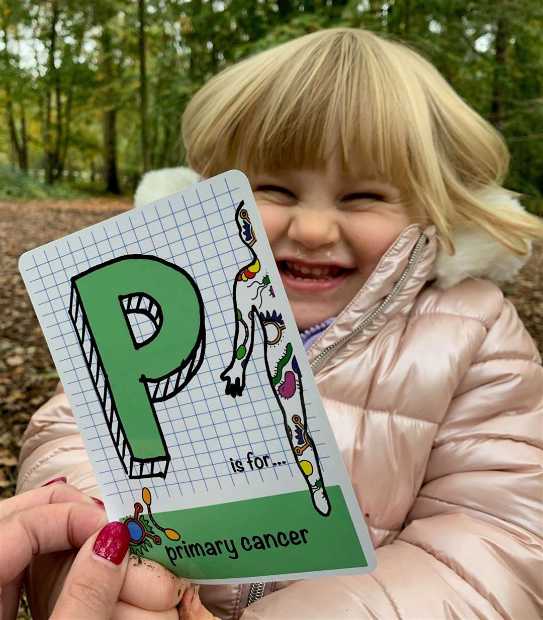 Nic's daughter Poppy with one of the flash cards
