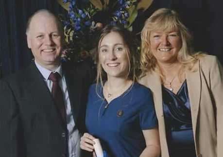 Hannah with her parents Lisa and Mark Catton