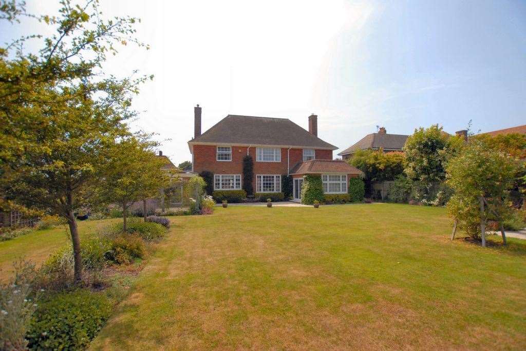 This four-bedroom freehold stands out for its impressive gardens of grass and delicate flower beds. Photo: Zoopla