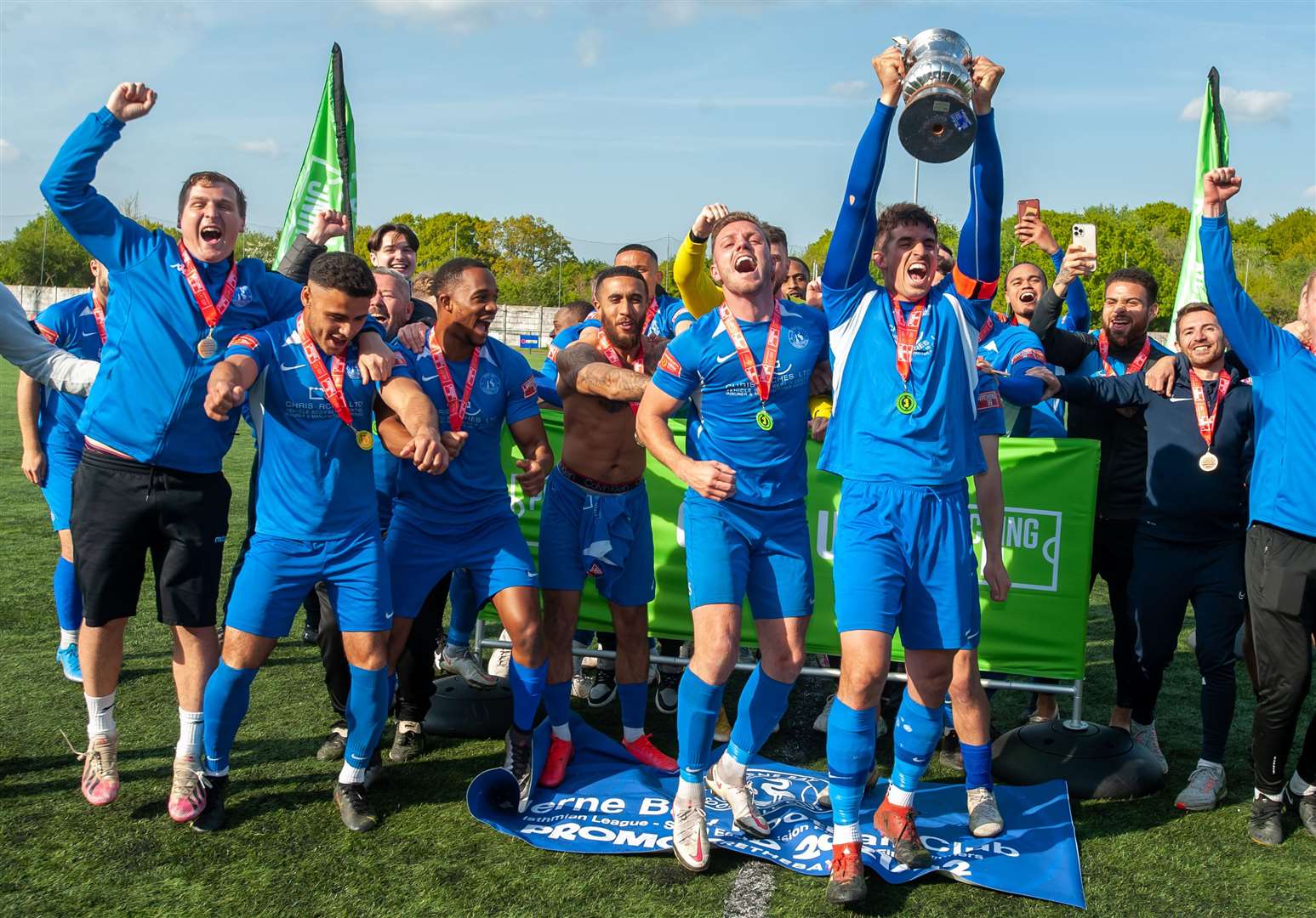 Herne Bay skipper Laurence Harvey lifts the Isthmian South East play-off final winners' trophy. Picture: Ian Scammell
