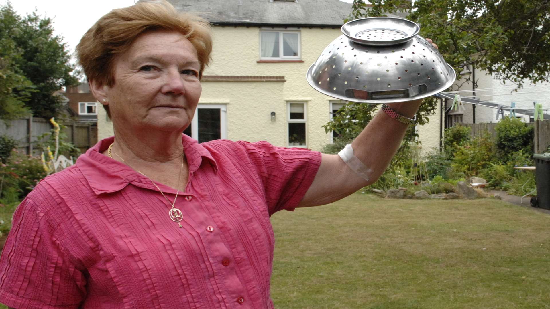 Dina Wilson with the colander she used to protect her from seagull attacks in Herne Bay. Picture: Chris Davey