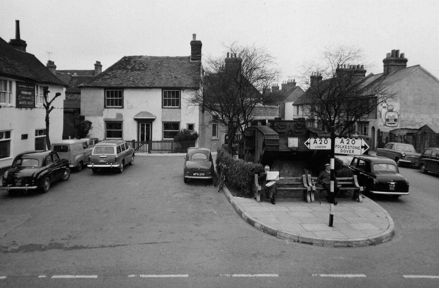 The pub - pictured in 1957 - next to the town’s tank