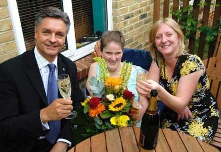 Claire Somerville celebrating with KCC's Kevin Lynes and her care manager Kirstine Mitchell