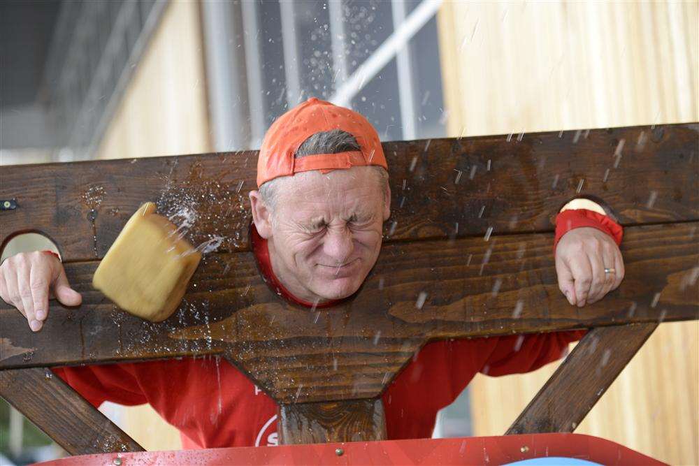 The manager of the Sainsbury's Ashford store John Webb gets sponged in aid of Sport Relief