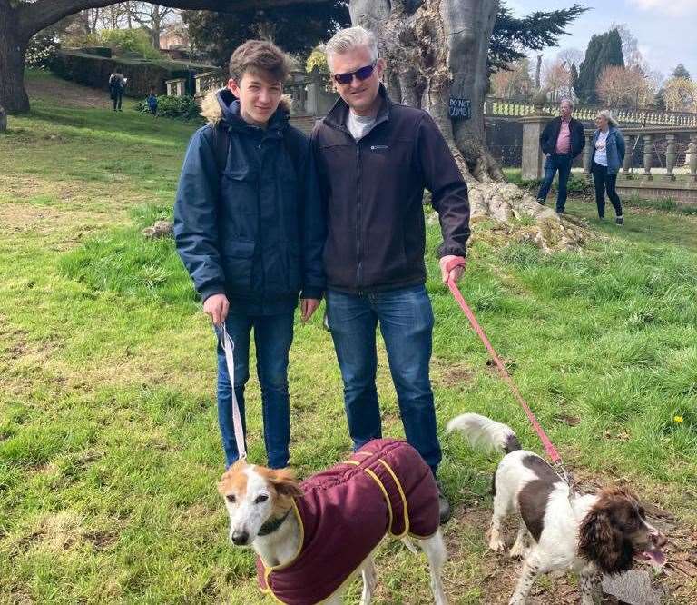 Neil and his son with their two dogs