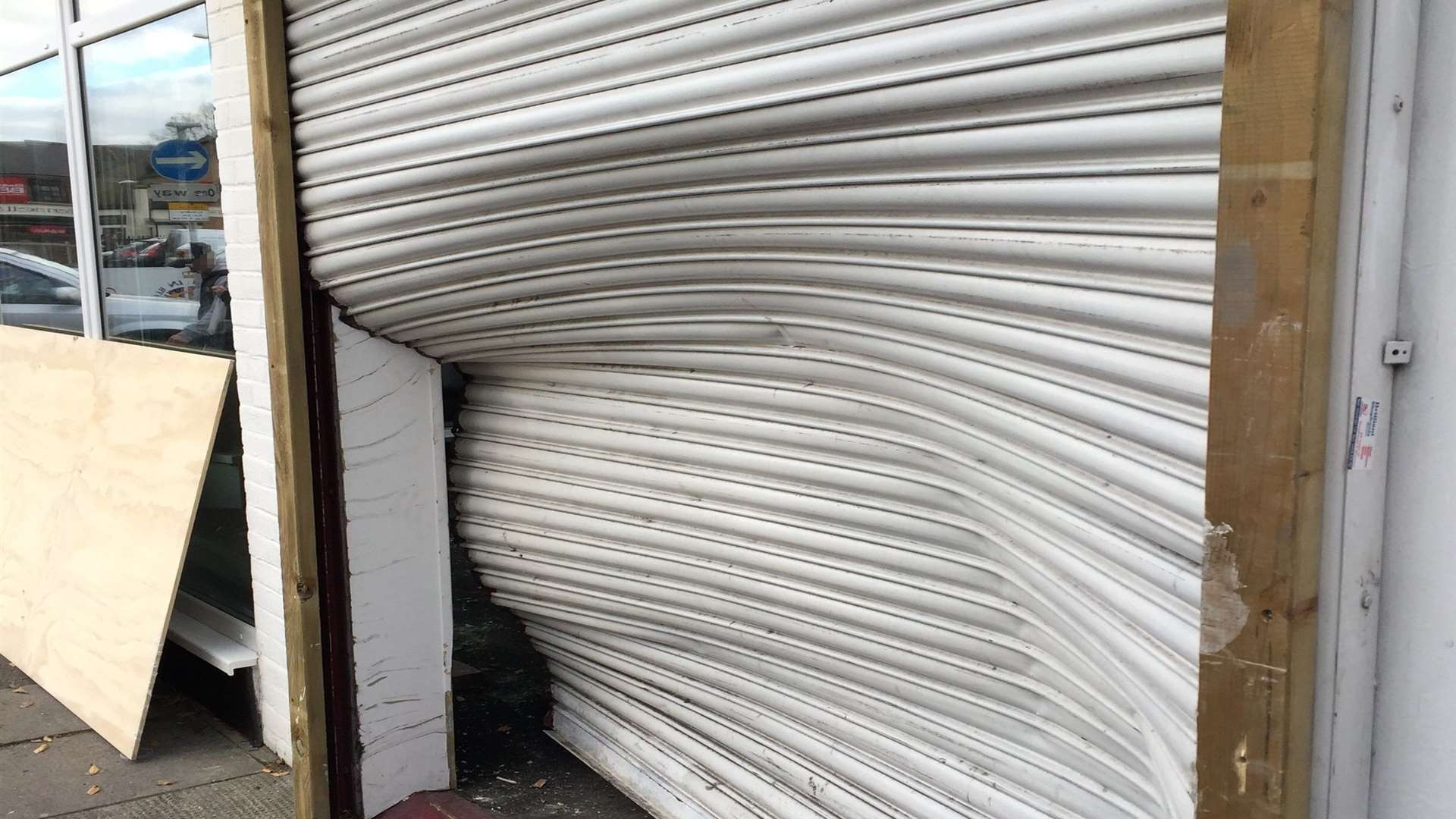 The damage the car caused to the shutters. Pic: Kent Police