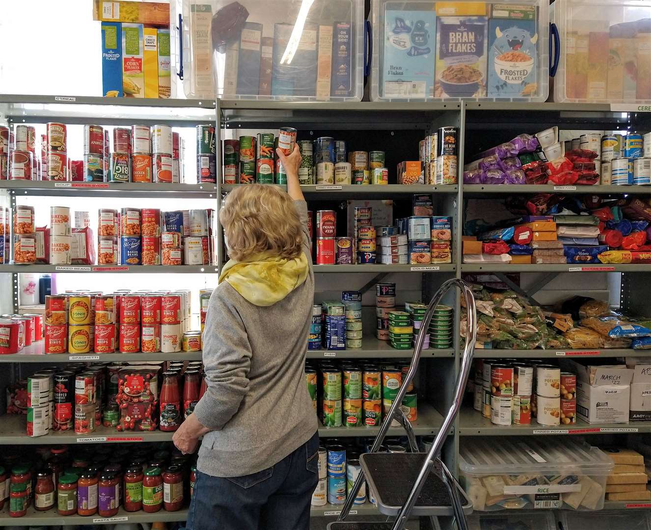 A camera-shy volunteer is adding stock to the shelves following a busy session. Pic: Mary Ransom