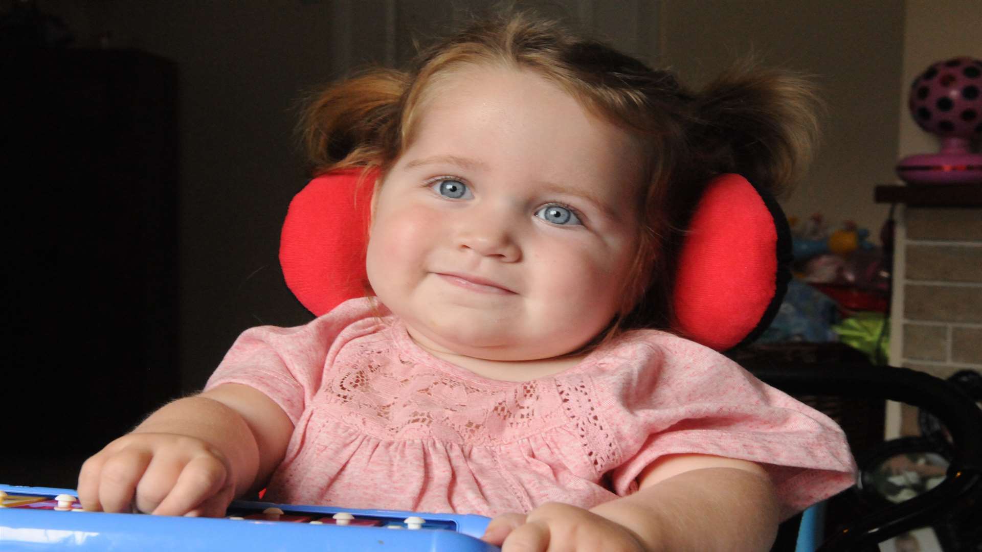 Her parents are trying to raise £26,000 to buy her a specially adapted power wheelchair, called a snap dragon. Picture: Steve Crispe.