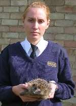 TRAGIC: RSPCA inspector Charlotte Eyden with the dead hedgehog. Picture: MATT HOOPLE
