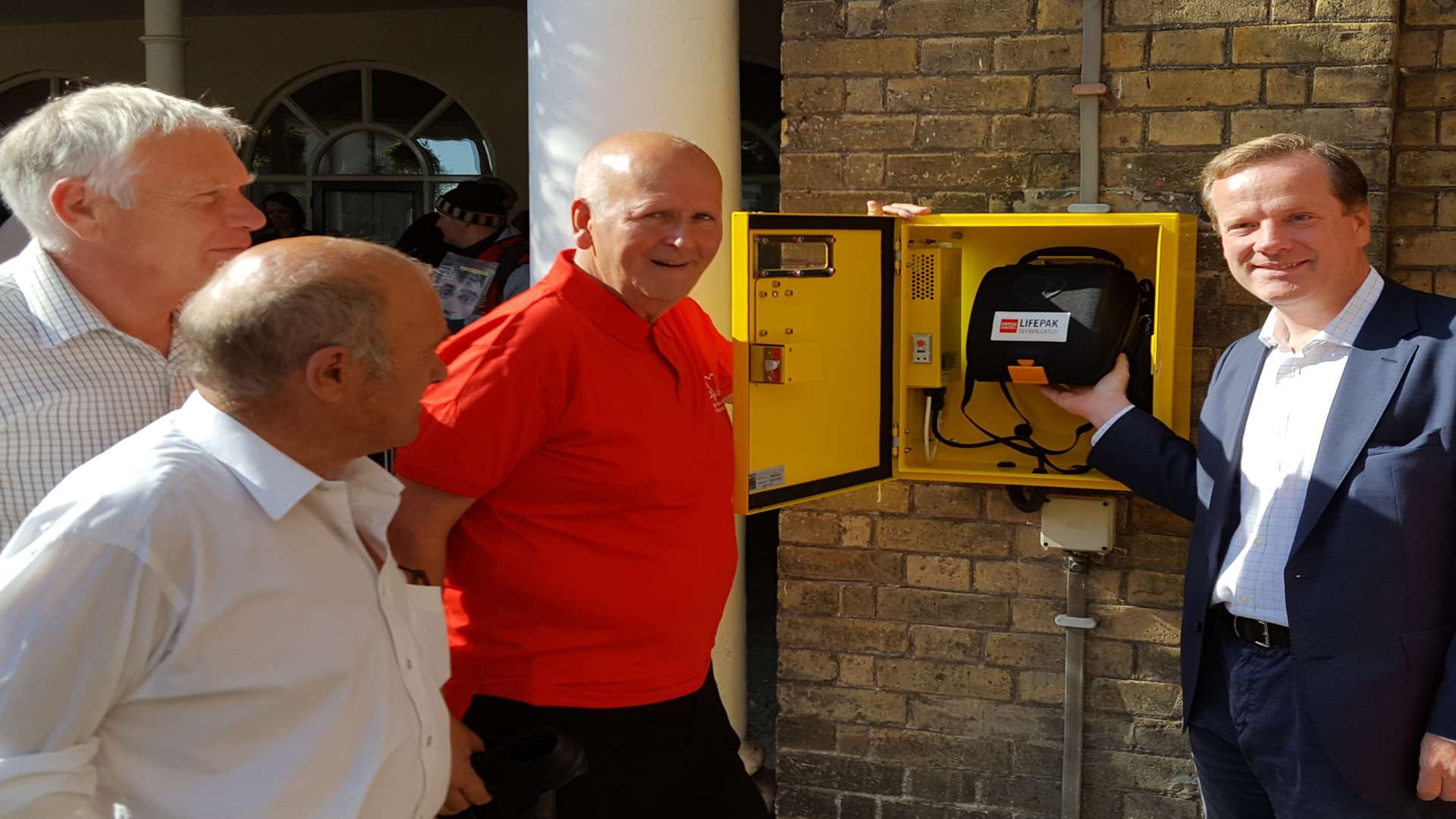 MP Charlie Elphicke MP, former mayor Adrian Friend, Cllr Wayne Elliott and Chaplain Paul Fermor take a look at the defibrillator