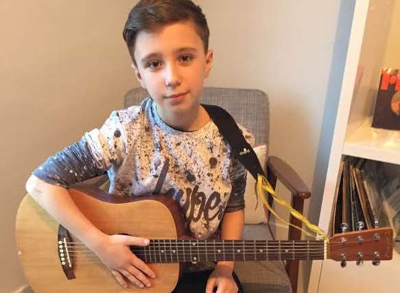 Charlie Salustro-Smart, a budding singer and guitar player from Deal