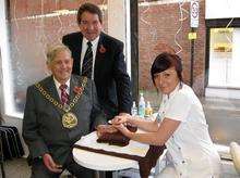 Mayor of Swale, Steve Worrall, and Sheppey MP Gordon Henderson check out the manicures on offer with Daisy Hook-Utting